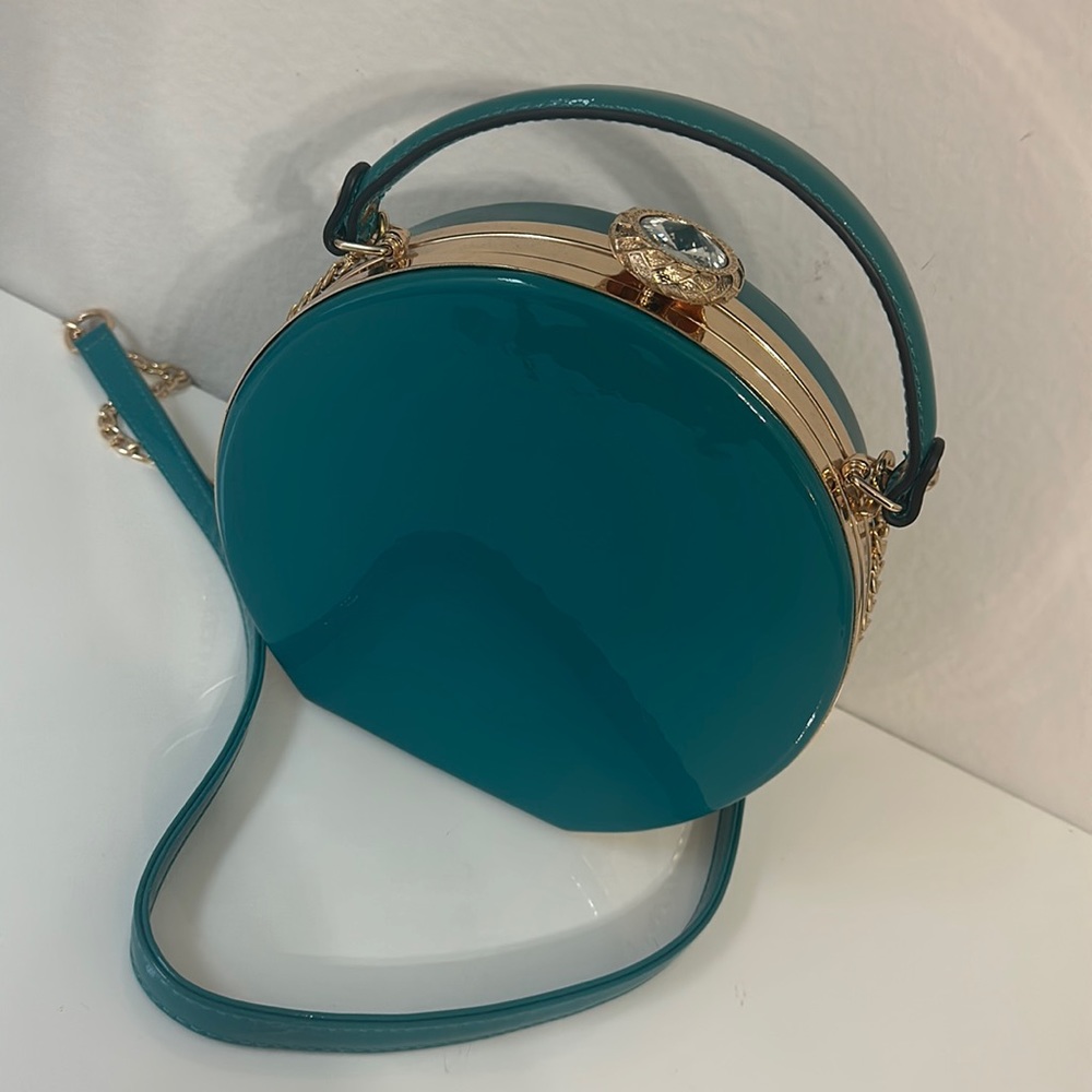 Crossbody clutch, teal color, gold chain, like new